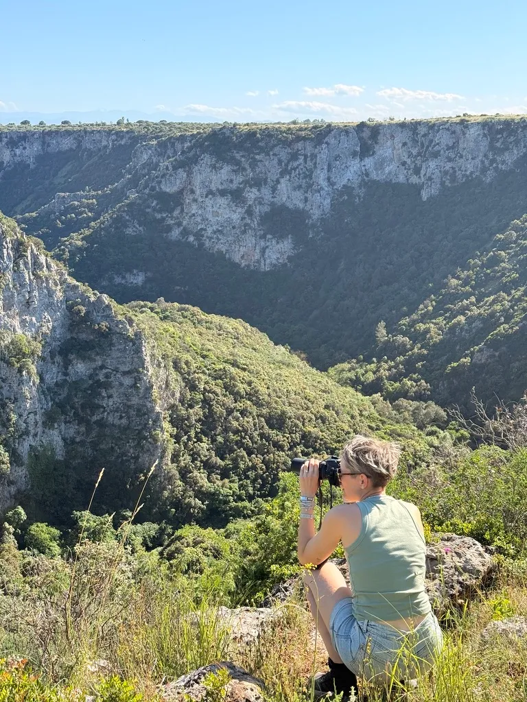 His companion photographs the gorges from a rock